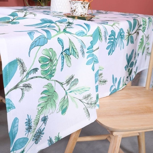 Nordic cotton linen tablecloth featuring green tropical monstera leaf prints for dining decor