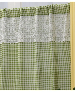 Close-up of green checkered cafe curtain with white crochet lace trim details