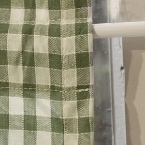 Nordic style green and white plaid cafe curtain with woven texture on a white rod