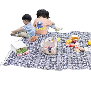 Bohemian geometric picnic blanket with fringe for outdoor camping and beach trips