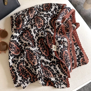 Detail of leopard print pleated scarf with texture and In My Dream woven label