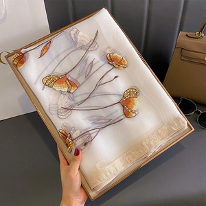 Detail of silk blend scarf with floral embroidery and pearls in a premium gift box
