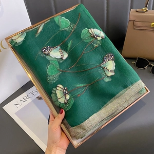 Detailed embroidery with pearls and sequins on premium dark green silk blend scarf