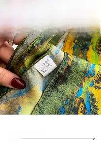 Macro shot of 100% mulberry silk scarf featuring fine rolled edges and artistic print