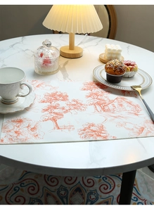Detail of waterproof cotton linen placemat with orange French country landscape print