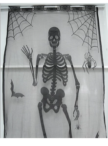 Detail of Halloween black lace curtain with skull, spider web and bat patterns