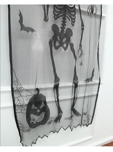 Detail of Halloween black lace curtain featuring skeleton, pumpkin and bat patterns