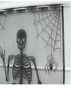 Detail of Halloween black lace curtain featuring skull and spider web mesh design