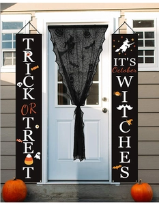 Halloween lace spider web curtains with Trick or Treat banners and festive ornaments