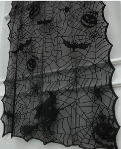Detail of Halloween black lace valance with spider web, pumpkin and witch motifs