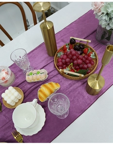 Detailed texture of purple Italian velvet table runner with elegant dining setup