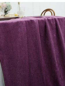 Detail view of premium dark purple velvet table runner with smooth texture and soft sheen