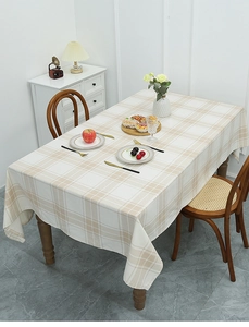 Detail of Nordic style checkered tablecloth with beige and white cotton linen texture