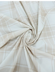 Close-up of beige and white checkered linen fabric texture with soft draped folds