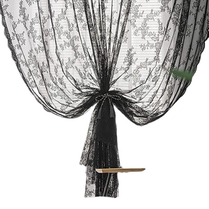 Elegant black wavy lace sheer curtain with floral patterns and a tassel tieback for decor