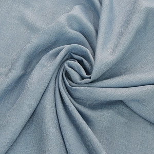 Elegant light blue Nordic tablecloth with delicate ruffled texture and premium draped fabric
