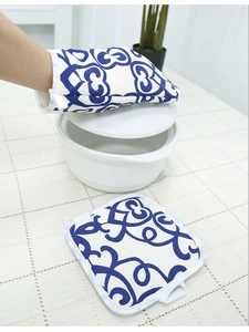 Thickened oven mitt and pot holder set with blue wave pattern in a kitchen setting