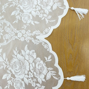 French style white rose lace valance with tassels on a wooden surface for home decor