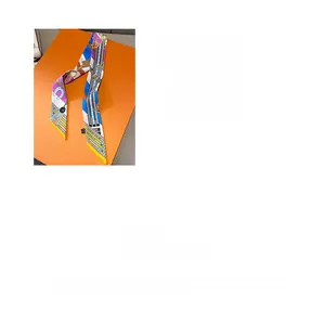 Detail showing colorful chain print twilly scarf with horse harness pattern elements