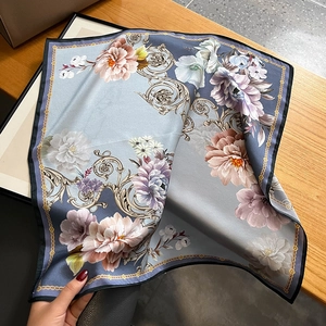 Blue silk square scarf featuring pink floral patterns and golden baroque scrollwork