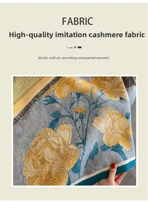 Detailed close-up of premium cashmere-like fabric with yellow floral patterns and fringe