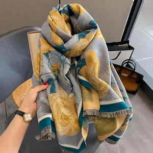 Grey cashmere-like scarf with yellow floral prints and fringed edges for winter warmth