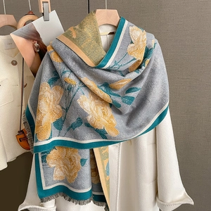 Winter floral cashmere shawl in dark grey and yellow with elegant fringe details