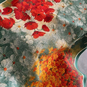 Thick cashmere-like scarf with red poppy and gingko leaf patterns on dark green base