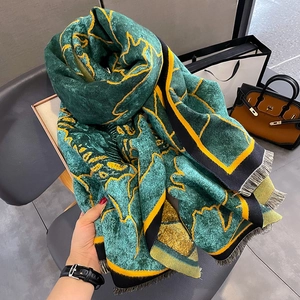 Winter floral cashmere shawl in dark green with yellow prints and fringe edges