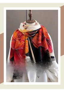 Close-up of floral print winter scarf with tassels and thick cashmere-like texture