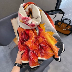 Thick cashmere-like winter scarf with warm floral print and elegant fringe details