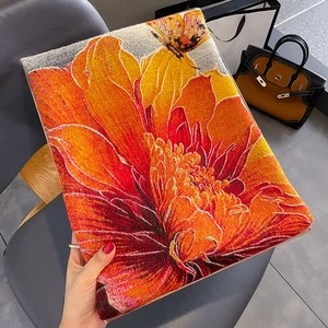 Thick floral cashmere shawl in orange and red with butterfly jacquard knit pattern