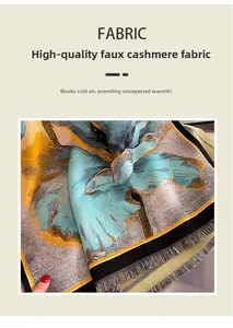Detailed texture of imitation cashmere scarf with blue and gold floral print and tassels