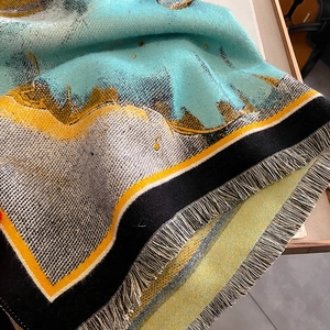 Thick cashmere-feel scarf in bold blue and yellow color blocks with elegant fringe tassels