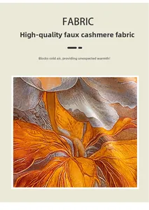 Macro detail of soft imitation cashmere scarf with bright orange floral print and premium texture