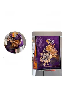 Detail of dark purple shawl featuring yellow floral prints and soft tassel trim accents