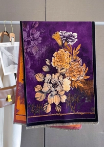 Detail of purple floral cashmere scarf with retro flower pattern and fringe edges