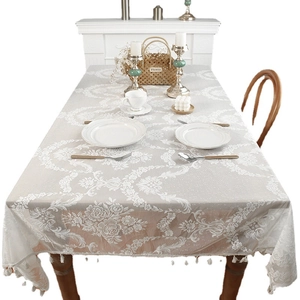 Elegant ivory lace tablecloth with damask patterns and tassel edges for dining decor