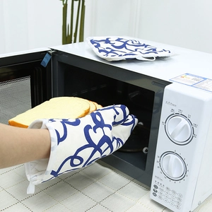 Nordic style blue floral oven mitt and pot holder set for heat resistant baking kitchen use