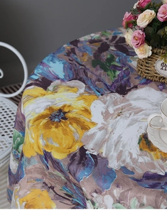 Close-up of abstract impressionist floral pattern on a waterproof round tablecloth