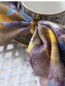 Macro view of abstract oil painting print silk scarf with golden metal ring buckle