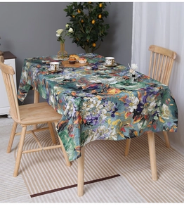 Close-up of waterproof oil painting tablecloth with retro floral patterns in home setting
