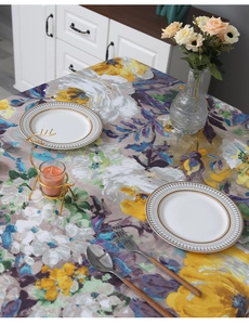 Detail of Impressionist floral tablecloth featuring abstract oil painting patterns