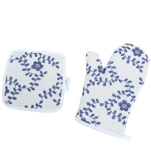 Nordic floral oven mitt and pot holder set in cream cotton with blue patterns