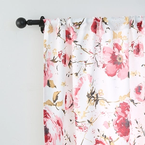Detail of floral printed blackout curtain showing pink flowers and rod pocket design