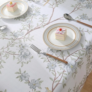 Nordic style tablecloth with green leaves and forest bird print on off-white linen fabric