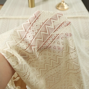 Off-white lace tablecloth with geometric patterns and tassel fringe for rustic home decor