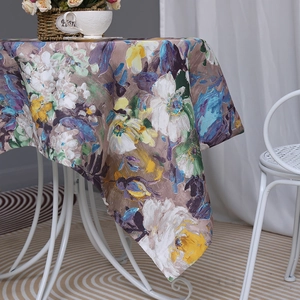 Waterproof oil painting tablecloth with abstract colorful floral patterns on a round table