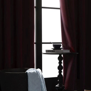 Deep burgundy blackout curtains with premium draped fabric for a modern home interior