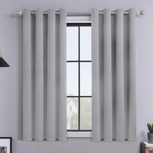 Modern light gray blackout curtains with metal grommets for living room window decor